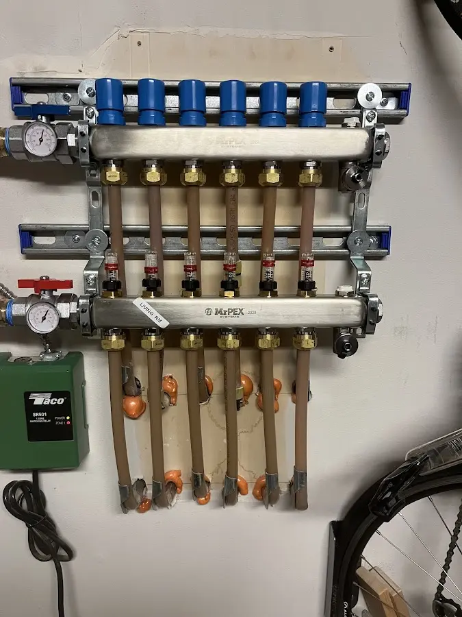 Plumber performing Water Heater Repair at a residential property in Chatham